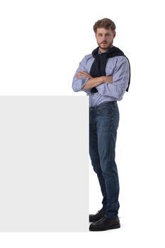 Full length portrait of young business man in casual clothes holding blank banner with copy space for your text isolated on white background