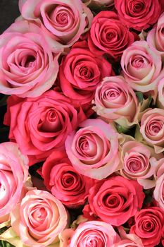 Mixed pink roses in a floral wedding decoration