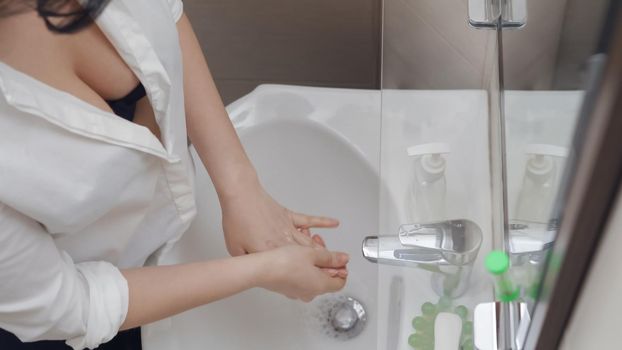 Woman Washes Hands As Often As Possible
