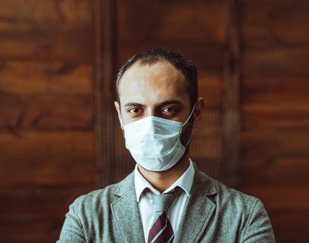 Confidence Man In Protective Mask Stand Alone In Office