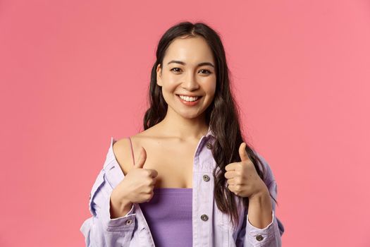 Sounds good Im in. Close-up portrait of satisfied, excited smiling beautiful asian girl in stylish outfit, recommend product, pleased with service or company, show thumbs-up, like and approve