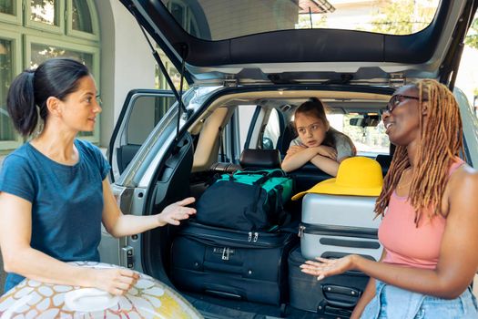 Diverse people travelling on vacation by car