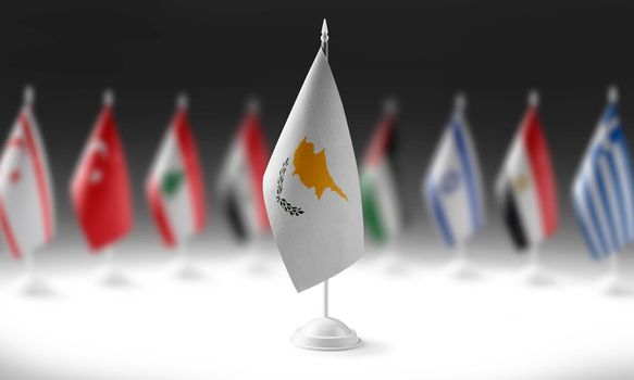 The national flag of the Cyprus on the background of flags of other countries