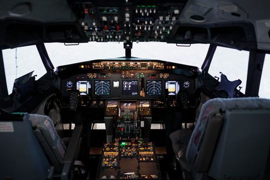 Nobody in airplane cockpit with electronic flying navigation panel