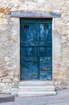 Blue wooden exterior door in a small european village