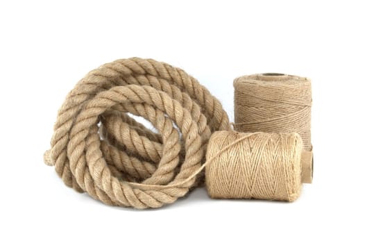 Twisted jute rope and spools of burlap threads or twine