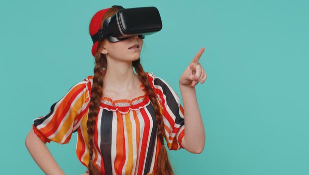 Redhead girl in headset helmet app to play simulation realistic game, watching virtual reality video