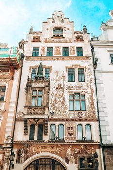 Prague, Czech Republic - July 2022. Facade of Storch House (Storchuv dum) publishing in Neo-Renaissance style. Balcony and decorated frescoes building in european capital, Old town square.