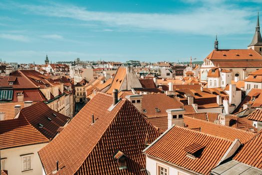 View from terrace on Prague buildings roofs with typical traditional red roof tiles. Czech republic, old european city.