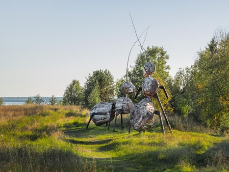 KARGOPOL, RUSSIA - September 10, 2018. Wooden statues of ants in park named Path of anthills.