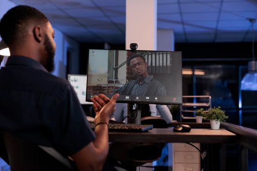 Company employee meeting with man on remote teleconference chat