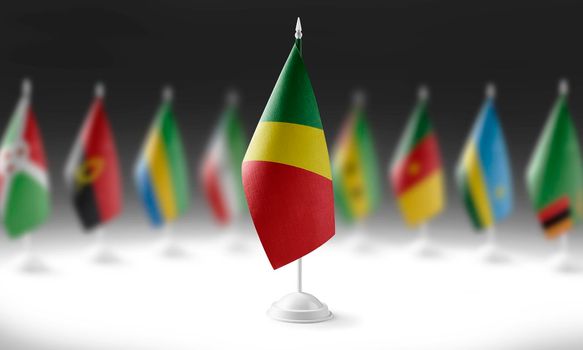 The national flag of the Congo on the background of flags of other countries