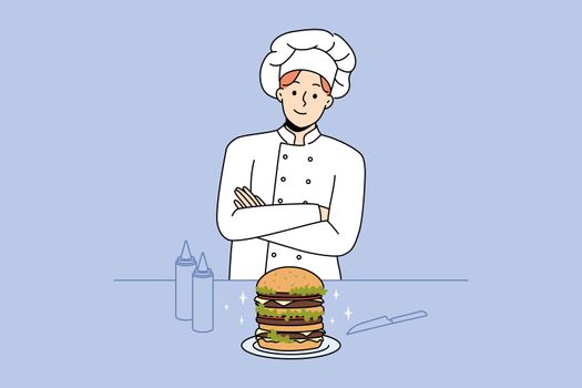 Chef cook burger in restaurant
