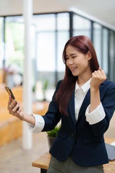 Businessmen use the smart phone to contact partners, success concept