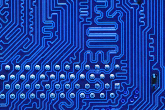 Blue Circuit board, electronic computer hardware technology. Motherboard digital chip. Technical science