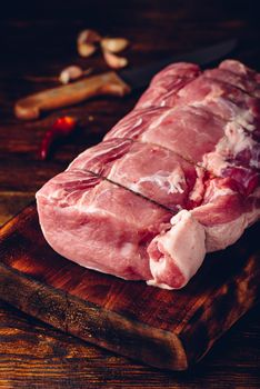 Pork loin joint on cutting board