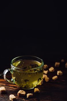 Cup of herbal tea with refined sugar