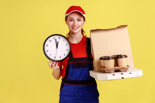 Courier woman holding wall clock and coffee with pizza box, express delivery in time.