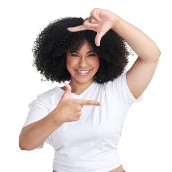 The camera loves you. Studio shot of an attractive young woman making a finger frame of her face against a white background.