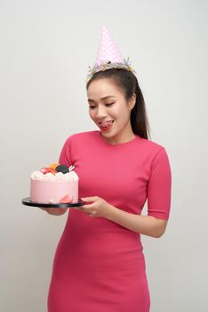 Smiling asian young woman celebrating birthday.