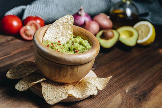 guacamole with tortilla chips and ingredients