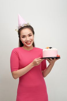 Girl with birthday cake on a white background