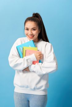 Nice female student smiling and looking at camera