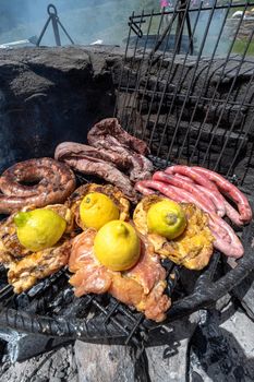 Typical Uruguayan and Argentine Asado Cooked on fire. Entrana and Vacio meat cuts. Accompanied with Chorizo
