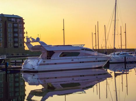 Cityscape sunset coast boats and dike panorama Bremerhaven Germany.