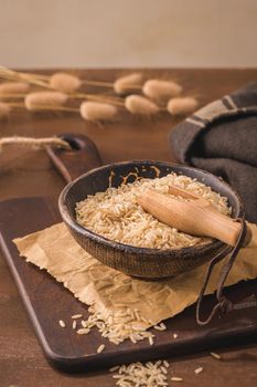 Brown rice on rustic countertop