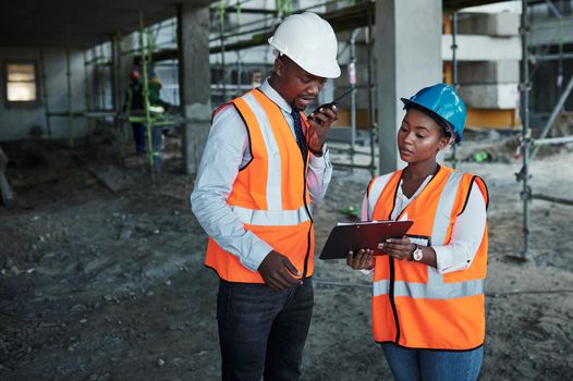 Brilliance is born when the best works with the best. a young man and woman having a discussion while working at a construction site.