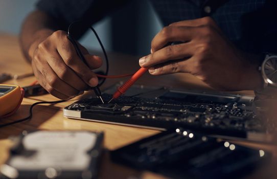 Nothing is too faulty for his expert hands. an unrecognisable technician repairing computer hardware.