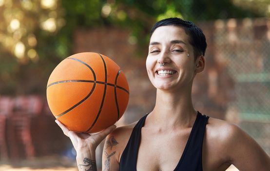 Winner stays on. Cropped portrait of an attractive young female athlete standing on the basketball court.