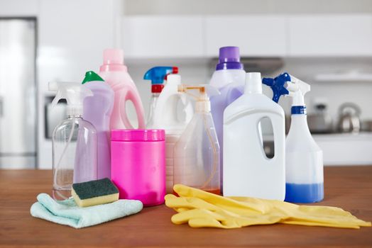 Top quality products for a cleaning pro. various cleaning products on a table in the kitchen at home.