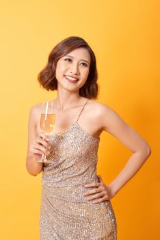 beautiful girl in long dress with champagne