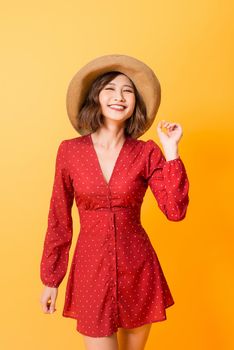 Asian girl wearing red dress with brown hat over orange background.