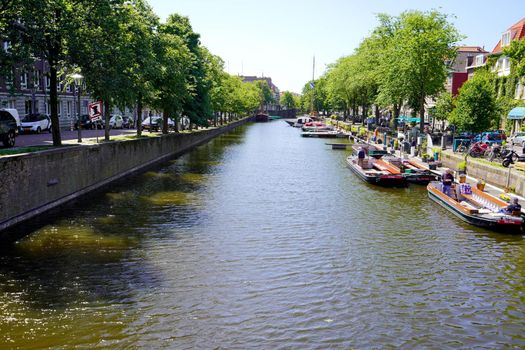 THE HAGUE, NETHERLANDS - JUNE 9, 2022: Canal in The Hague administrative and royal capital of the Netherlands