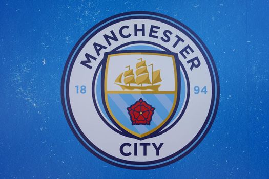 MANCHESTER, UNITED KINGDOM - JULY 13, 2022: The Logo of Manchester City Football Club at the stadium, Manchester, UK