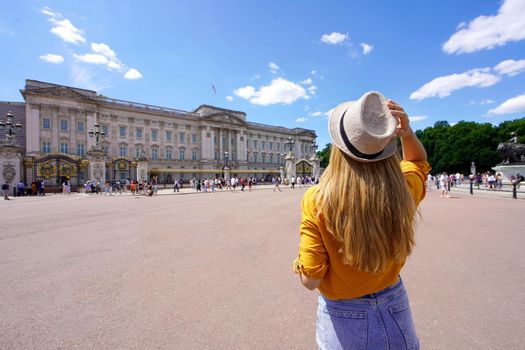 Back view of young tourist woman visiting London, United Kingdom
