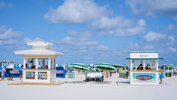 Miami Beach Florida May 2022 colorful beach with umbrellas and beach huts.