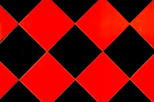 Red and black mosaic ceramic tile abstract pattern interior surface floor texture background