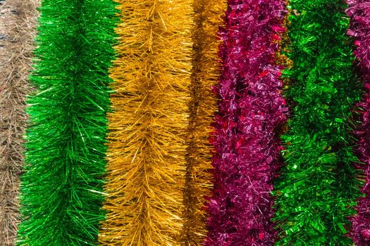 Christmas bright colored tinsel decor and christmas background decorations