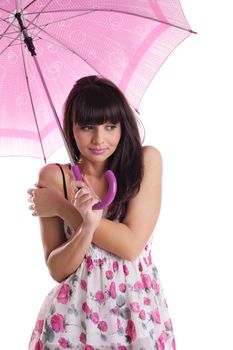 Girl freeze under rose umbrella in summer dress