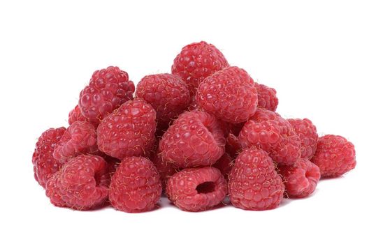 Stack of fresh red raspberries on white isolated background
