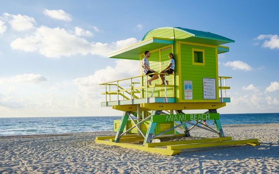 Miami beach, couple on the beach at Miami beach, life guard hut Miami beach Florida