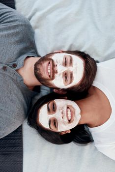 Lockdown is the perfect time for a skin detox. a young couple getting homemade facials together at home.