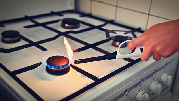 Gas stove for cooking in the kitchen. Gas crisis in Europe - high energy prices and stoppage of gas supplies. Russian war in Ukraine.