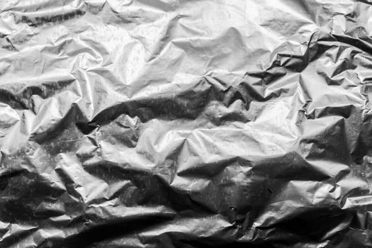 Foil crumpled texture wrinkled silver material abstract pattern surface background