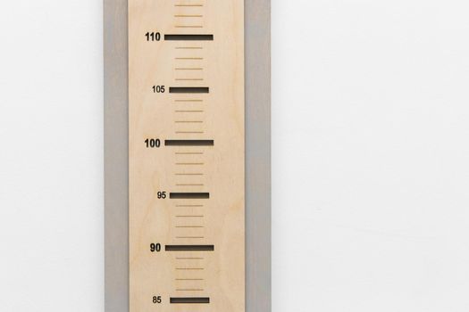Ruler height measure child height scale size against a white wall