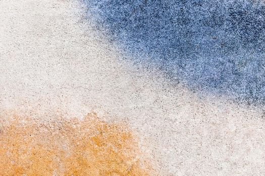 Orange and blue paint slick urban old colored design dirty concrete wall texture background
